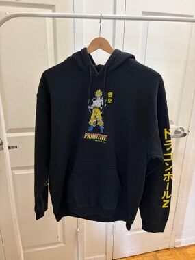 Primitive Black Pullover Hoodie with Yellow Anime Graphic